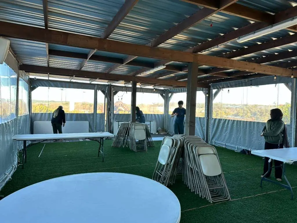 Empty tables and chairs ready in the ICLT garden tent