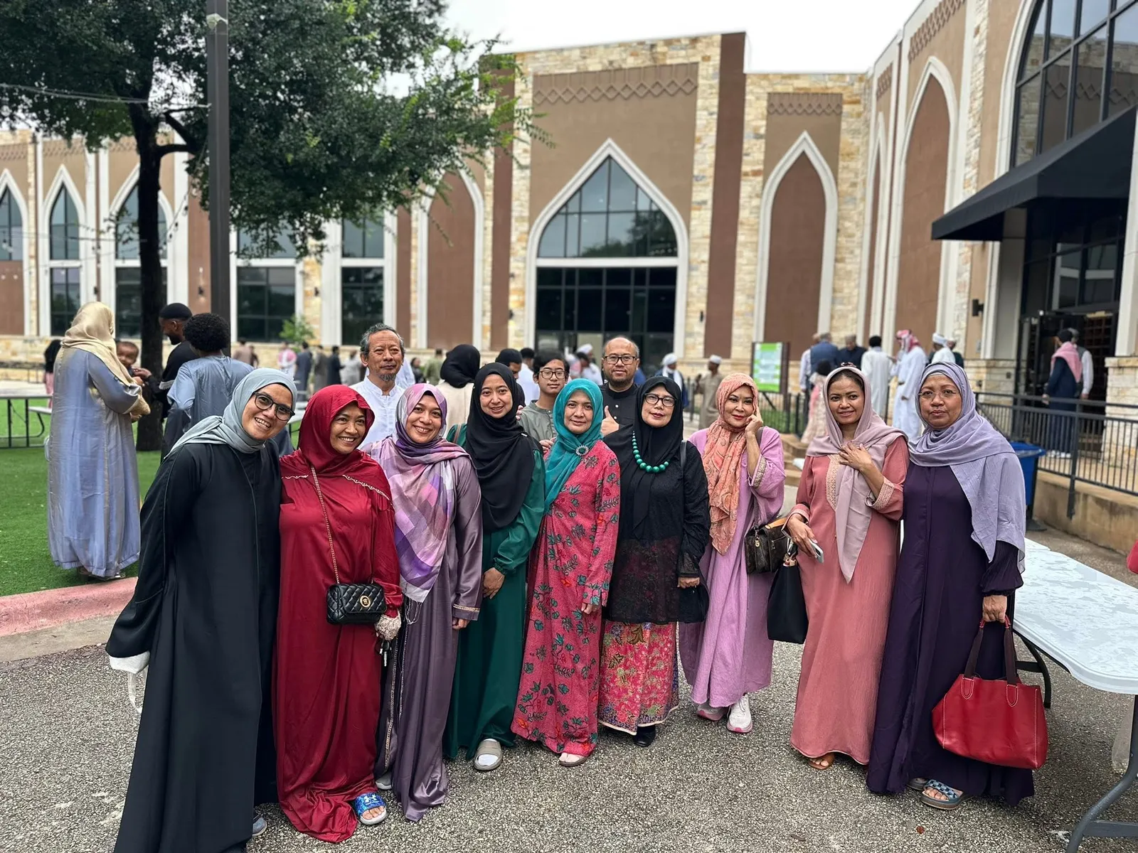 IMATX ibu-ibu and bapak-bapak standing together in front of the masjid after Eid prayer