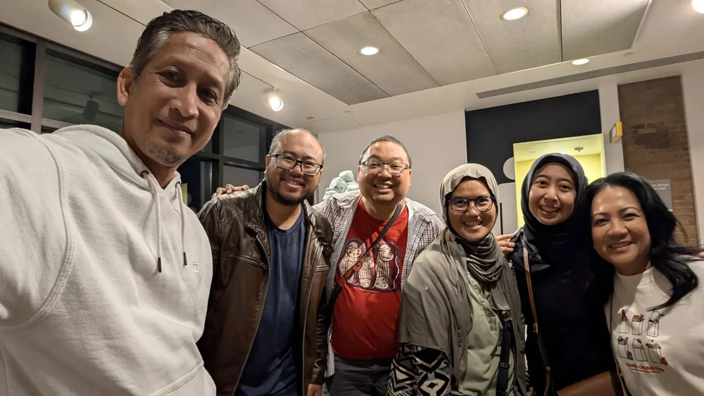 IMATX members smiling together in a selfie